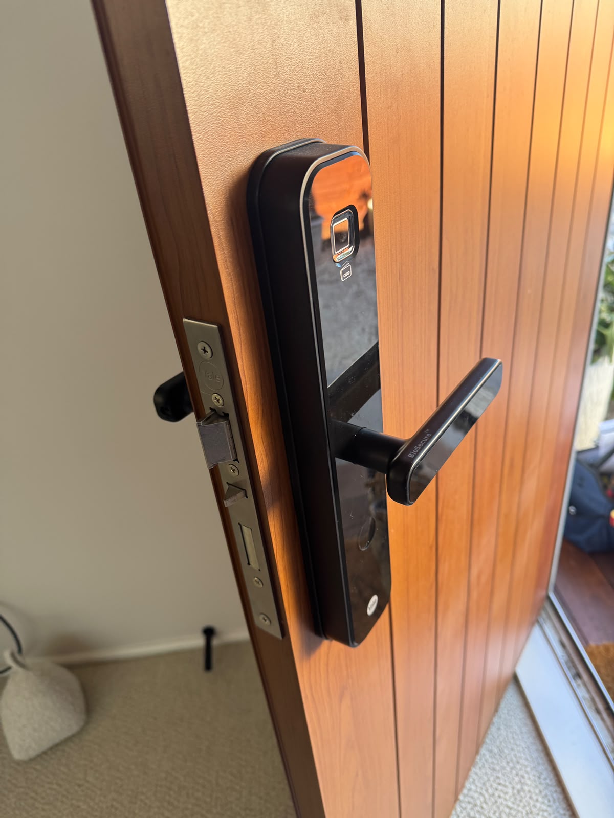 Fingerprint entry on a Grey Lynn villa's cedar door