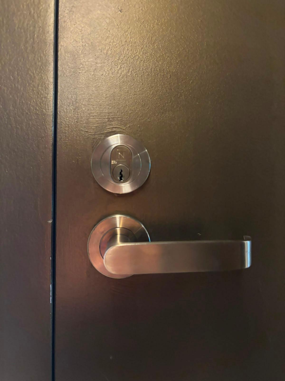 Deadbolt and lever set installed on a Devonport door